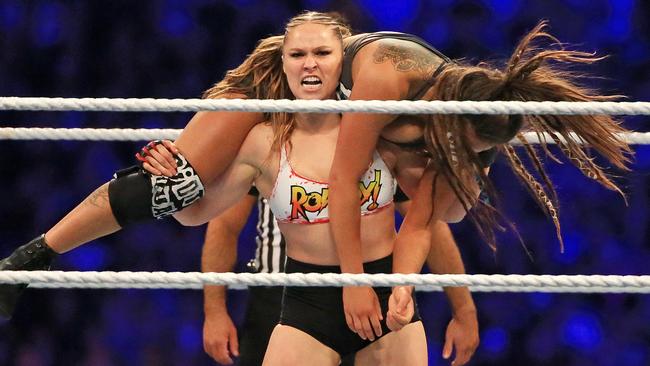 Ronda Rousey gets the better of one of the Riott Squad at WWE’s Super Show-Down Wrestling at the MCG. Picture: Mark Stewart