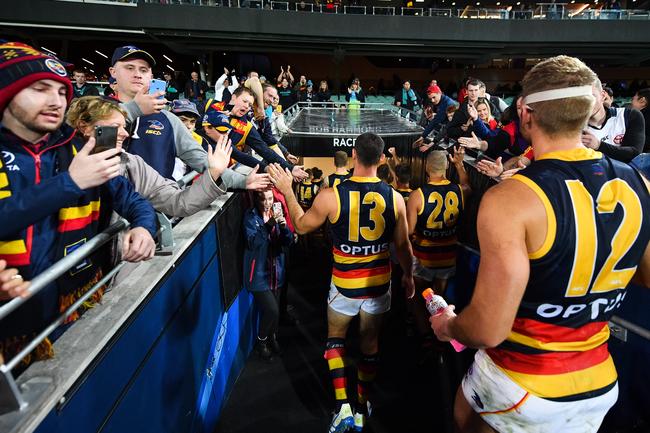 Crows Taylor Walker and Daniel Talia walk off the ground after the round eight victory in Showdown 46 at Adelaide Oval. Picture: Daniel Kalisz/Getty