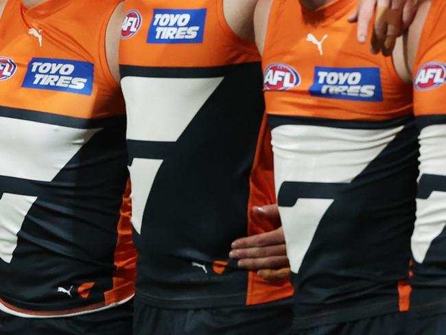 SYDNEY, AUSTRALIA - SEPTEMBER 14:  The Giants line up for the welcome to country and national anthem ceremony during the AFL First Semi Final match between GWS Giants and Brisbane Lions at ENGIE Stadium, on September 14, 2024, in Sydney, Australia. (Photo by Matt King/AFL Photos/via Getty Images)