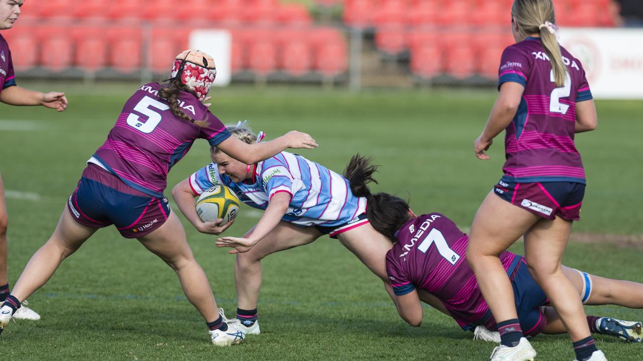 Kayla Jackson of Roma Echnidas Womens 7s is tackled. Picture: Kevin Farmer