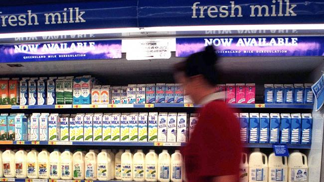 Cartons of milk line the shelves at a Woolworths' supermarket.