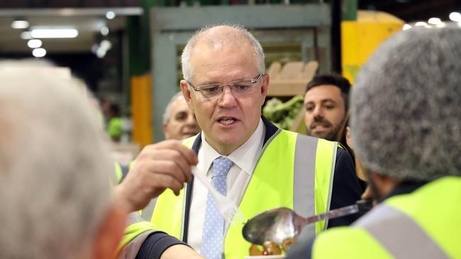 NEWS2019ELECTION16/05/2019. DAY36/Job1Prime Minister Scott Morrison with his wife Jenny on day 36 campaigning at the Sydney markets in Sydney.Also attending were Dr Fiona Martin Ð Liberal Candidate for Reid and John Pascucci Ð Head of Operations, Sydney Markets Limited.Picture Gary Ramage