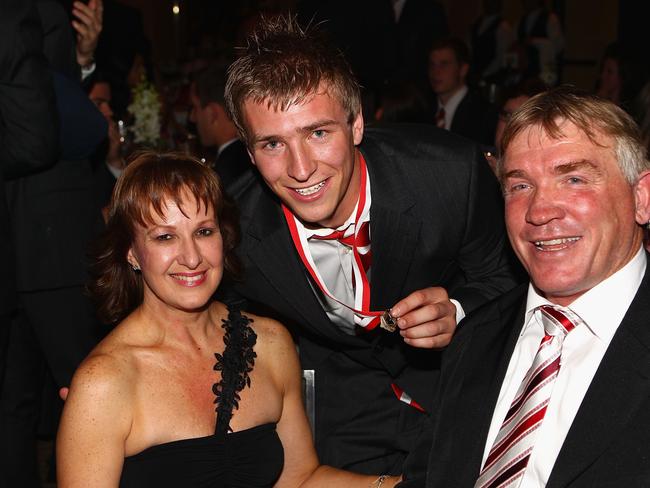 Kieren Jack posing with his father Garry Jack and mother Donna after winning the Bob Skilton Club Champion Medal in 2010.