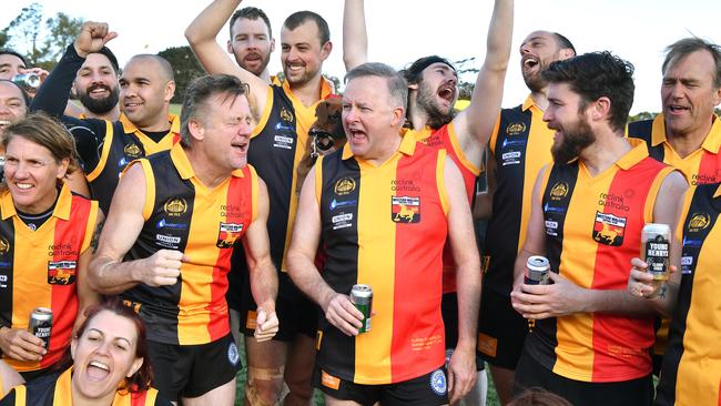 Anthony Albanese celebrates with Western Walers teammates after winning the annual AFL Reclink Community Cup match at Henson Park in Sydney. Picture: AAP