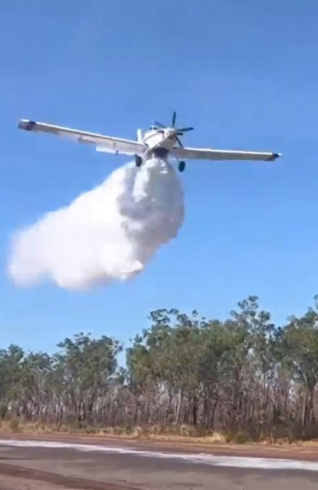 Bushfires NT aircraft conducting a water bombing activity.