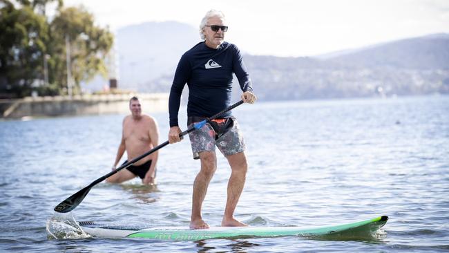 Steven Last felt like he was dancing on water after paddle boarding in perfect weather conditions at Long Beach, Sandy Bay. Picture: Chris Kidd