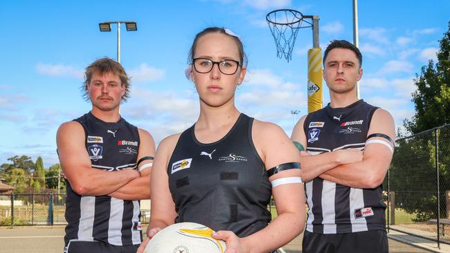 Darcy Coon, Tia Stinchcombe and Alex Riches from the Clunes Magpies Football Netball Club wearing black and white armbands. Black in memory of Hannah McGuire, white in honour of the White Ribbon Foundation. Picture: Brendan Beckett