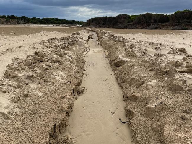 An illegal estuary opening in the Thompson Creek estuary at Breamlea. Picture: Corangamite Catchment Management Authority