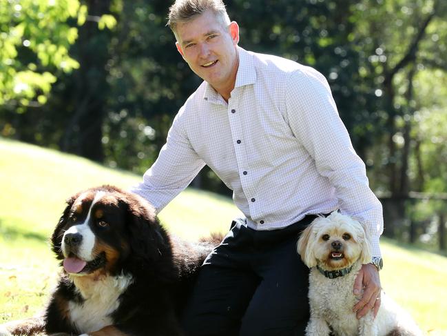 Greencross founder Glen Richards at home with his dogs Beau and Alfie, Brookfield west of Brisbane. Picture: Liam Kidston.