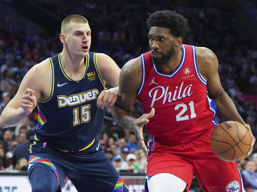 Joel Embiid of the Philadelphia 76ers drives to the basket against Nikola Jokic of the Denver Nuggets. The elite centres are leading NBA MVP contenders. Picture: Mitchell Leff/Getty Images