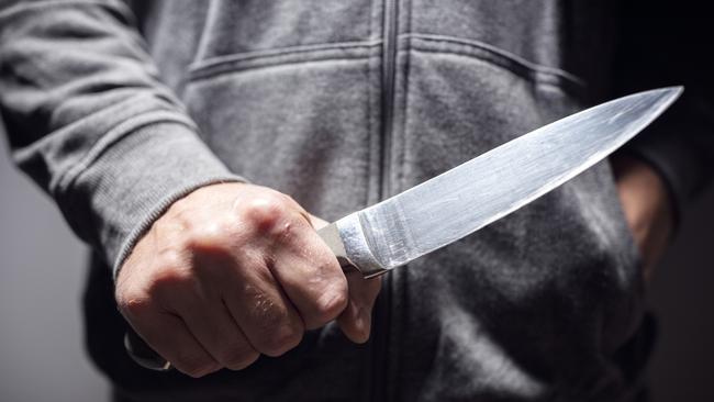 A man has faced court after brandishing a knife from the top of his car after a pub brawl.