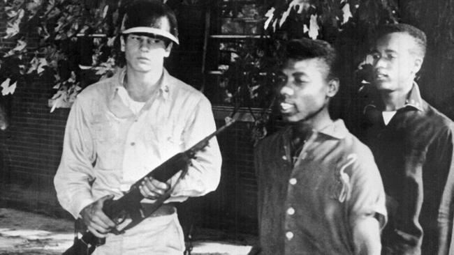 Nine black children, three boys and six girls, were escorted by US paratroopers in full battle dress from Central High School in this 25 September 1957 file photo in Little Rock, Arkansas. The fifty year anniversary of the event is remembered 25 September 2007. US President Eisenhower had decided the day before to send Federal troops in Arkansas and bring the state under Federal control to protect black children against white demonstrators. Earlier in September 1957, the Governor of Arkansas Orval Faubus ordered the state militia to bar the entry of the black children to the school. He said he would never allow black children to enter a white school despite the order from the Federal District Court. The Federal troops kept the childr