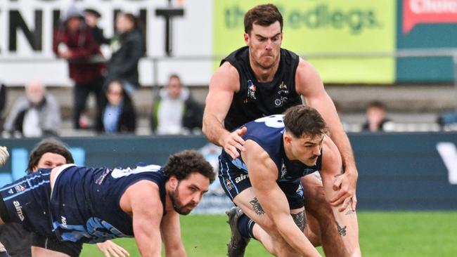 Scott Lycett lays a tackle against Glenunga in the 2024 D1 grand final. He has signed a two-year extension with Port District. Picture: Brenton Edwards