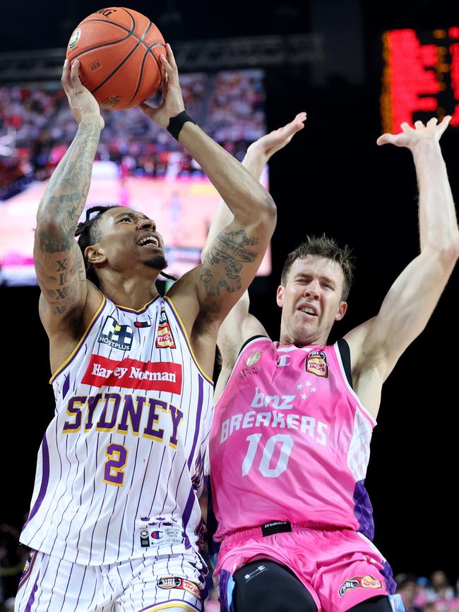 Jaylen Adams of the Sydney Kings is under pressure from Tom Abercrombie of the New Zealand Breakers at Spark Arena on December 22, 2023 in Auckland, New Zealand. (Photo by Phil Walter/Getty Images)