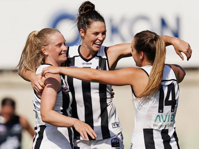 The Magpies celebrate their first ever win over Carlton in the AFLW