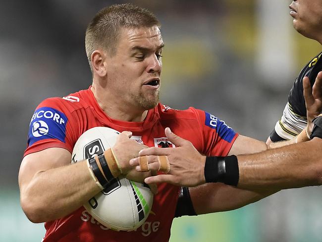 TOWNSVILLE, AUSTRALIA - SEPTEMBER 06: Matt Dufty of the Dragons is tackled by Jake Clifford of the Cowboys during the round 17 NRL match between the North Queensland Cowboys and the St George Illawarra Dragons at QCB Stadium on September 06, 2020 in Townsville, Australia. (Photo by Ian Hitchcock/Getty Images)