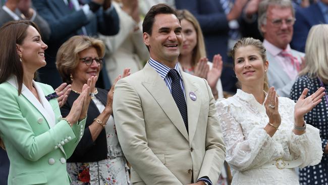 Federer absorbs his ovation. Kate and his wife, Mirka, joined in. Picture: Adrian Dennis/AFP