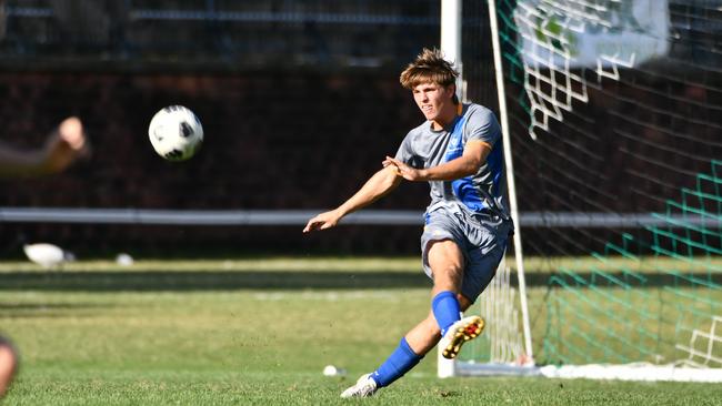 Oliver Reid whips in a long ball.