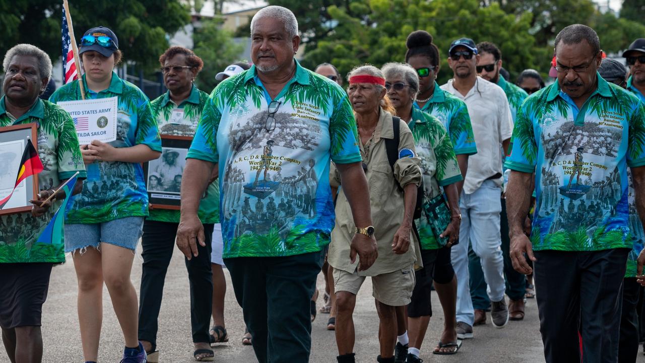 Members of the Torres Strait Island community march during the Torres Strait Island Light Infantry Battalion 80th anniversary parade held at Thursday Island. Picture: Supplied