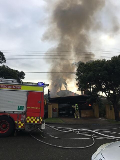 Fire crews attempt to contain a blaze in Seaforth. Picture: supplied