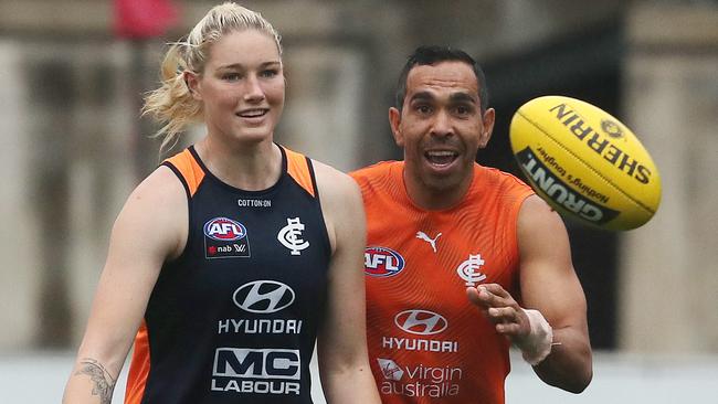 Eddie Betts with AFLW star Tayla Harris at joint men’s and women’s training session. Picture: Michael Klein