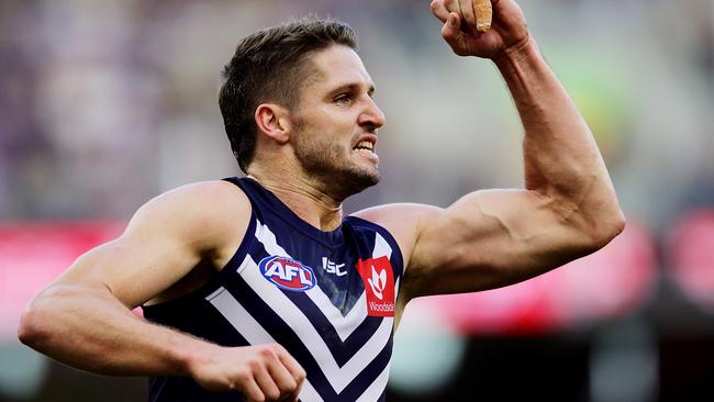 PERTH, AUSTRALIA - JUNE 15: Jesse Hogan of the Dockers celebrates after scoring a goal during the round 13 AFL match between the Fremantle Dockers and the Port Adelaide Power at Optus Stadium on June 15, 2019 in Perth, Australia. (Photo by Will Russell/AFL Photos/via Getty Images )