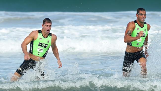 Shannon Eckstein and Matt Poole during the Nutri-Grain Ironman race at North Cronulla Beach. Picture: Gregg Porteous