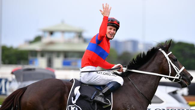 Jockey James McDonald gestures as he returns to the mounting yard after riding Verry Elegant to victory in the Tancred Stakes. Picture: AAP