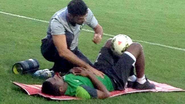 Nasser Al-Shamrani gets some work from the physio during Saudi Arabia training.