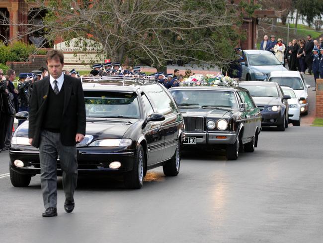 There was a huge community turnout in Cowra for the funerals of Walsh’s wife and grandchildren.