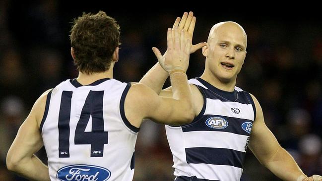 Gary Ablett high fives Joel Selwood in 2010.