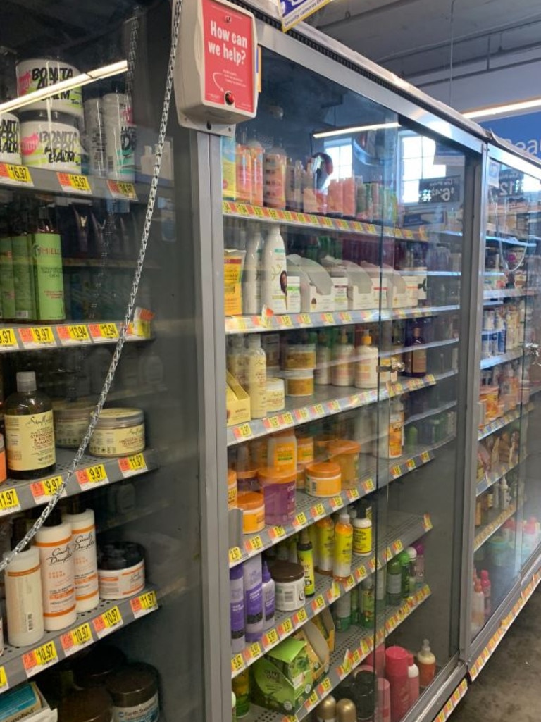 This now viral photo shows black hair products locked in a glass cabinet.