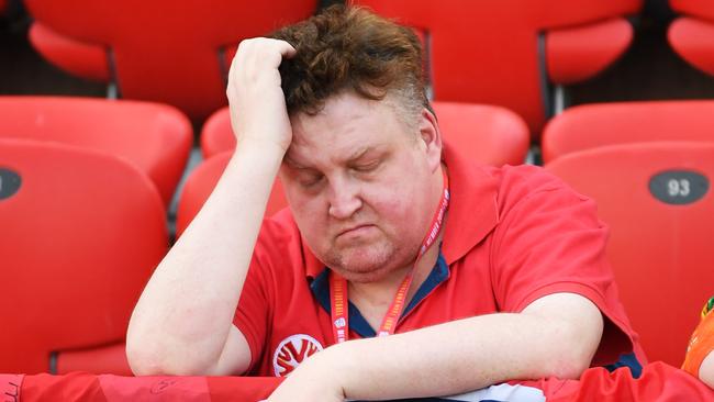 ADELAIDE, AUSTRALIA - DECEMBER 08: An Adelaide fan feels the heat during the round nine A-League match between Adelaide United and the Newcastle Jets at Coopers Stadium on December 08, 2019 in Adelaide, Australia. (Photo by Mark Brake/Getty Images)