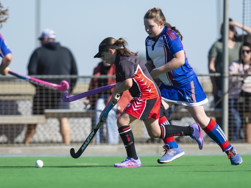 Mikayla Brasher (left) of Past High and Georgia Wilson of Rangeville in under-11 girls Presidents Cup hockey at Clyde Park, Saturday, May 27, 2023. Picture: Kevin Farmer