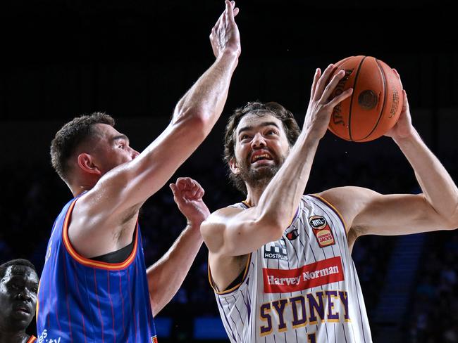 ADELAIDE, AUSTRALIA - FEBRUARY 02:  Jordan Hunter of the Kings  heads for the basket defended by Issac Humphries of the 36ers  during the round 18 NBL match between Adelaide 36ers and Sydney Kings at Adelaide Entertainment Centre, on February 02, 2024, in Adelaide, Australia. (Photo by Mark Brake/Getty Images)