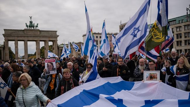 Supporters march at the Brandenburg Gate in Berlin on Sunday. Picture: Getty Images