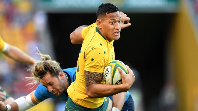 Israel Folau is tackled by Michele Campagnaro.