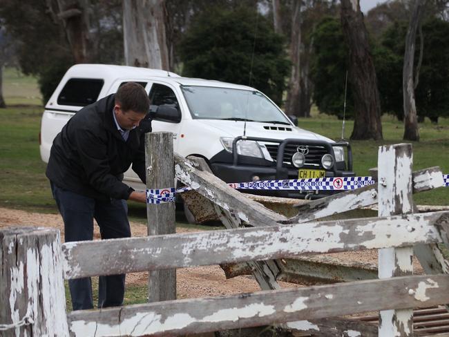 A detective cordons off the crime scene at “Pandora” property near Walcha. Picture: Marlon Dalton