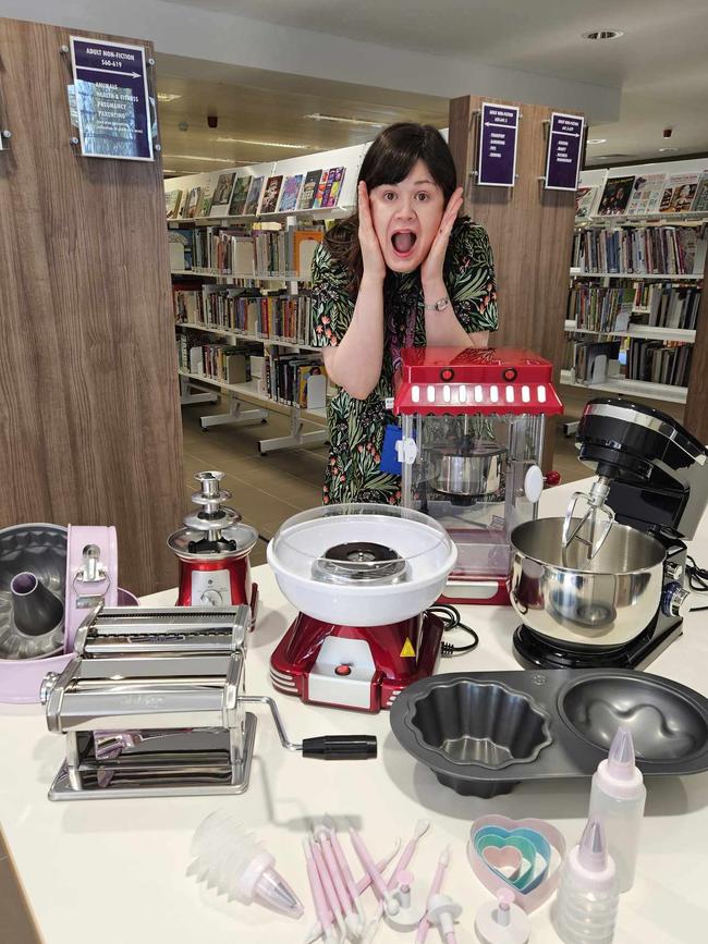 Woodcroft Library staff with some of the items available for borrowing. Picture: Supplied