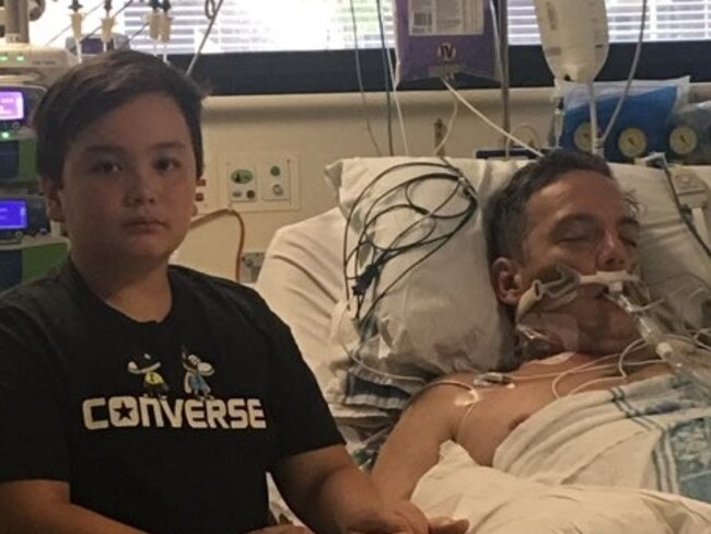 Ronan, 9, pictured with his critically ill father. Picture: Gofundme