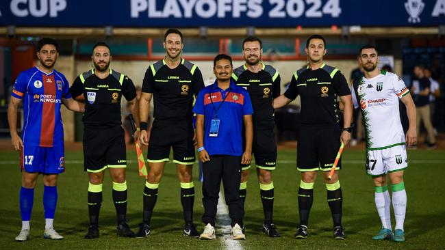 Kosta Grozos of the Jets and Ben Garuccio of Western United pose after the coin toss of the Australia Cup Play-Off match at Darwin Football Stadium. Picture: Mark Brake/Getty Images.