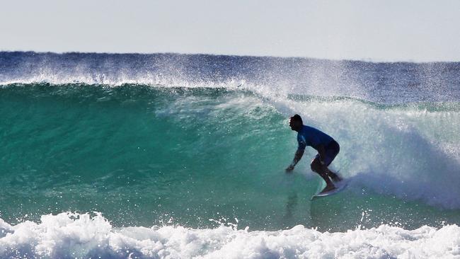 Work dumping more than 70 huge sandbags on the sea floor is expected to finish this month. Then we could see waves like this breaking on the reef. Pic Tim Marsden.