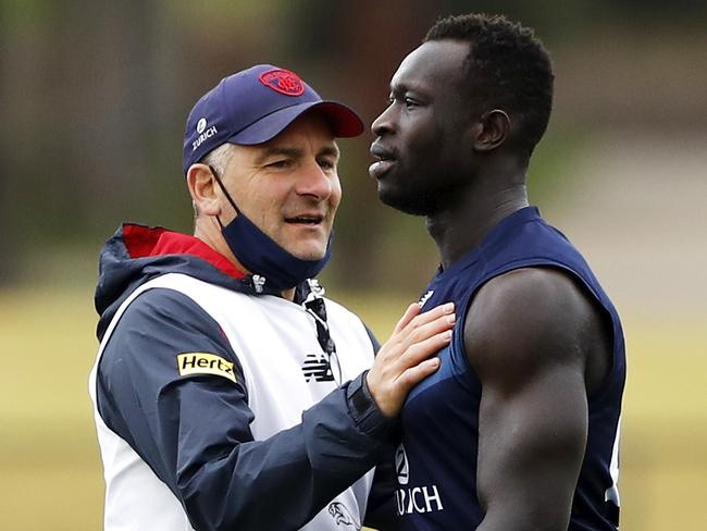 Melbourne midfield coach Adem Yze with Majak Daw last season. Picture: Dylan Burns/AFL Photos via Getty Images.