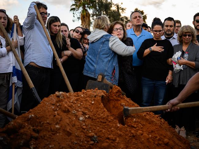 Mourners grieve during the funeral of Peruvian-Israeli civilian Dr. Daniel Levi Ludmir at Yehud Monosun cemetery near Tel Aiv, Israel. Picture: Getty Images