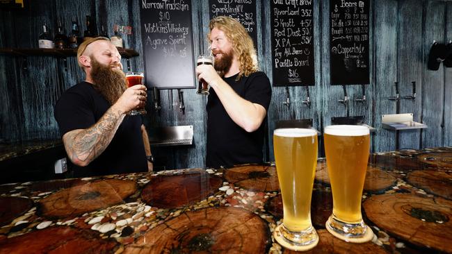 Copperlode Brewing Co is the first brewery to open on the southside of Cairns, offering beer lovers fresh drinks, food trucks and live music. Copperlode Brewing Co bar manager Daigo Kwik and head brewer Morgan Hind drink to the venture’s success. Picture: Brendan Radke