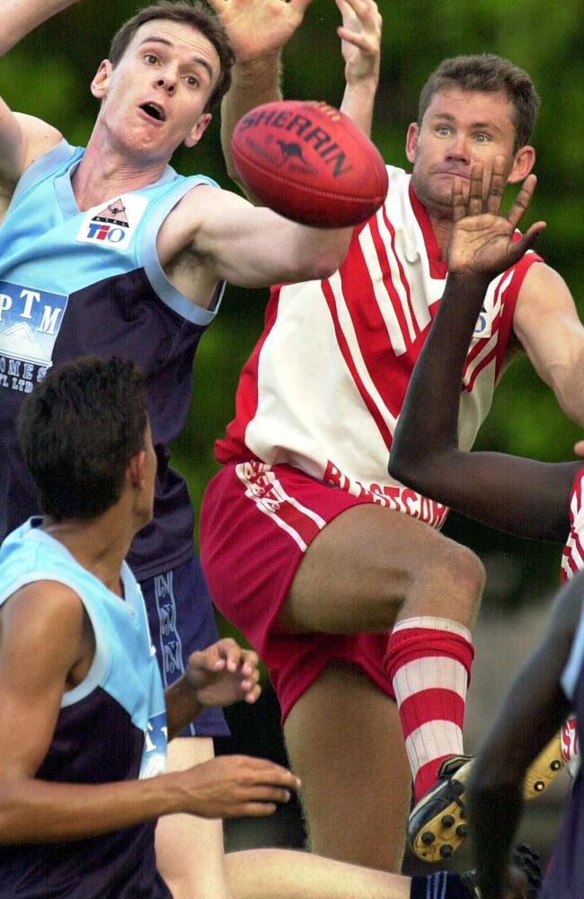 Waratahs' Gerard Atkins competeing at the ruck with Darwin's Scott Baxter.