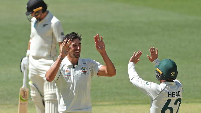 Mitchell Starc of Australia is congratulated by Travis Head after dismissing Jeet Raval of New Zealand during day 4 of the first Test match between Australia and New Zealand at Optus Stadium in Perth, Sunday, December 15, 2019. (AAP Image/Richard Wainwright) NO ARCHIVING, EDITORIAL USE ONLY, IMAGES TO BE USED FOR NEWS REPORTING PURPOSES ONLY, NO COMMERCIAL USE WHATSOEVER, NO USE IN BOOKS WITHOUT PRIOR WRITTEN CONSENT FROM AAP