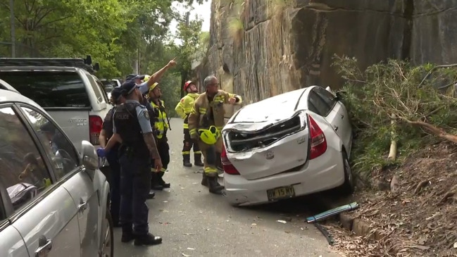 Car crashes over twenty metre cliff in Glebe