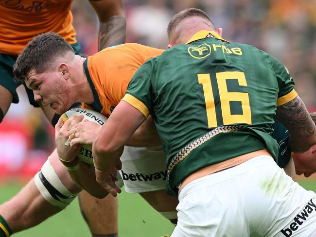 Carlo Tizzano (left) takes on the Springboks defence in Brisbane. Picture: Matt Roberts/Getty Images