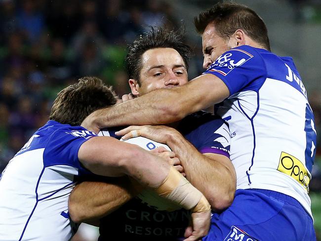 Cooper Cronk is tackled high by Josh Reynolds. Picture: Colleen Petch.